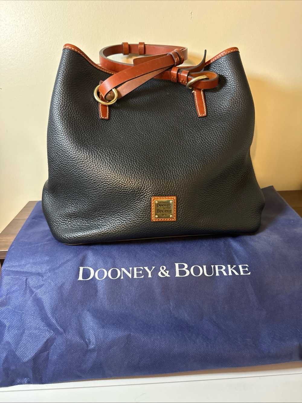 Dooney & Bourke Black Pebbled Leather Tote with Brown Trim and Gold Hardware